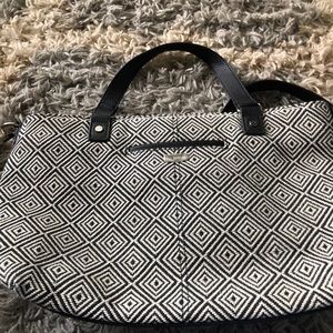 Thirty One Satchel that is black and white.